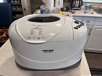 Front top view of white Black & Decker All-In-One Horizontal Deluxe Automatic Breadmaker showing control panel and buttons