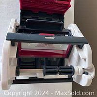 Zyliss Veggie Slicer showing the white and red body, handle, and attached blade holder with cutting blades