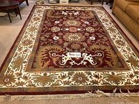 Full view of the Mystical Reflections area rug laid out in a living room setting, showing overall colors and decorative patterns.