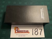 Black box labeled 'Semiconductor Laser Therapy Device' with lot number visible.