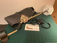 Full lot overview showing assembled detector, headphones, and case