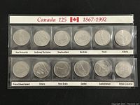 Front photo of the Canadian 25 cent coins set in clear plastic strips labeled with province and territory names, with "Canada 125 1867-1992" header.