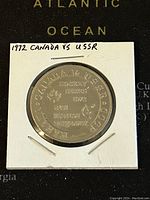 Front side of the commemorative hockey token with engraved text and emblems.