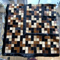Photo showing the entire leather floor mat with patchwork of colored leather squares.