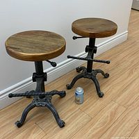 Front view of both stools with soda can for scale