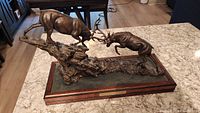 View of bronze elk sculpture on wood base