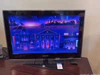 Front view of Samsung 31-inch TV powered on displaying screen image