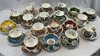 Overview of all 18 teacup and saucer sets arranged
