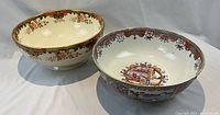 Both porcelain bowls side by side on white backdrop
