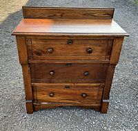 Front view of pine dresser showing three drawers and backsplash