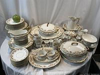 Overview of entire Limoges collection showing plates, bowls, cups, serving pieces
