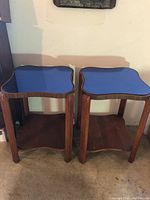 Front view of both end tables showing design and condition