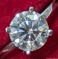 Top-down view of round brilliant diamond in six-prong setting