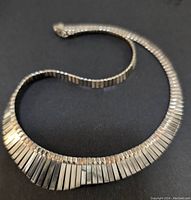 16 inch silver necklace segments showing polished and textured flat rectangular pieces.