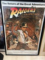Full view of framed Raiders of the Lost Ark movie poster showing main illustration and title.