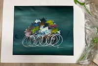 Full view of matted abstract oil painting on teal background