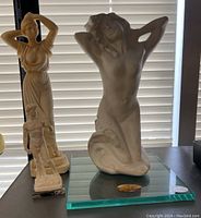 Three images of a white decorative Venus statue with a woman kneeling, hands behind head pose on a glass base to show full figure, details and angle views.