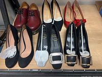 Full lot of shoes arranged on table