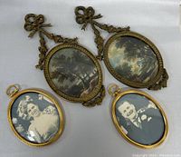 Four items arranged on white background: two vintage ornate oval framed artworks showing landscapes, and two smaller oval vintage framed black and white photos of a man and woman.