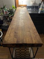 Top view of thick wooden butcher block showing weathered surface