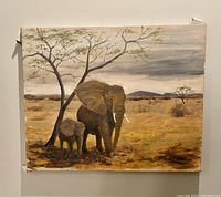 Front view of the oil painting depicting mother elephant and calf standing under tree in savannah landscape.
