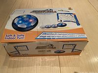 Photo of the hoverball toy packaging showing the hover disk, goal frame, and product branding.