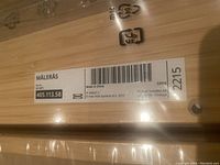 Close-up photo of the IKEA label on the shelf packaging showing the product name MÅLERÅS and barcode.