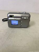 Rear view of Fuji FinePix A210 camera showing LCD screen, buttons, and viewfinder.