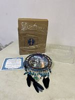 Full lot showing dreamcatcher, certificate, original box, and plastic packaging.