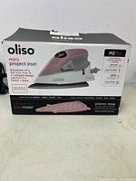 Front view of the Oliso Mini Project Iron M2 Pro box showing product image and key features