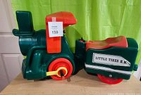 Side view of Little Tikes R.R. electric ride-on train vehicle in green and red plastic.