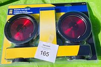 Front view of unopened magnetic tow light kit in blister packaging with label showing two round red lights and connecting bar.