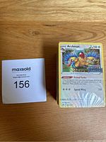 Front view of the sealed block of Pokémon booster packs featuring the Archeops Pokémon card art on the pack.