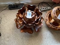 Large wooden chip and dip server resembling an opening rose bloom, shown assembled.