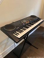 Casio CTK-541 keyboard angled view showing keys, speakers, and control panel.