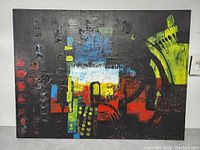 Full view of the modernist abstract oil painting on canvas showcasing geometric shapes and multiple bright colors with black textural background.