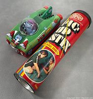 Tube container for vintage 1973 Pick Up Stix game showing graphics and label.