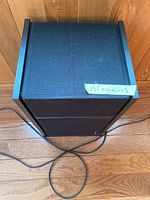 Top angled view of Bose speaker showing overall dimensions and top surface.