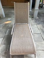 Top view of beige outdoor lounge chair showing seating and backrest fabric.