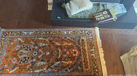 Top-down view of the rug fully laid out showing its full length and the intricate design elements.