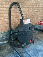 Front view of Sears Craftsman Professional shop vacuum with hose and wand attached