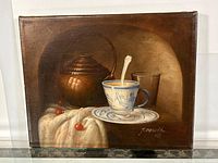 Full view of the oil on canvas painting showing a still life with a copper kettle, a blue and white cup and saucer, and cherries on a cloth.
