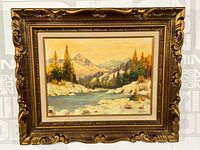 Framed landscape oil painting showing entire artwork and ornate gold frame