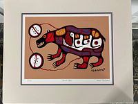 Framed numbered print of 'Sacred Bear' with artist signature and edition number 5/454 visible in margins.