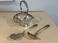 Basket and all flatware arranged on surface