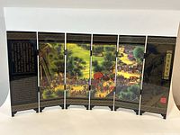 Front view of the six-panel folding screen showing the detailed Riverside Scene at Qingming Festival with vibrant colors and traditional architecture
