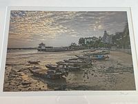 Close-up of the artist's signature visible on the bottom right corner of the print and the print's white matting border.