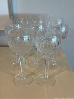 Eight glasses grouped together showing full set and pattern consistency.