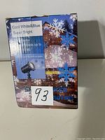 Box of the motion projector snowflakes light showing cool white and blue super bright LED projection, projecting up to 20 meters.