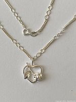 Sterling silver necklace showing chain design and clasp with 925 stamp.